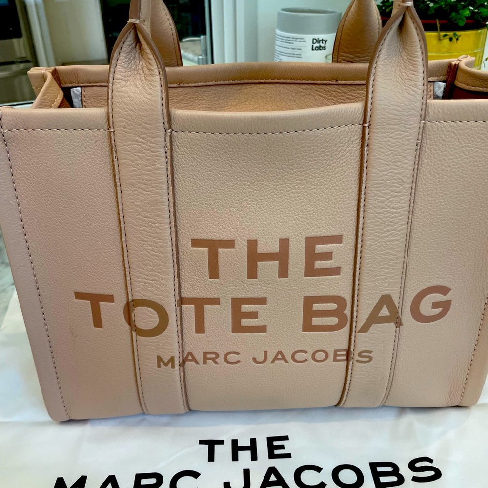 Marc Jacobs small travelers tote in pink.